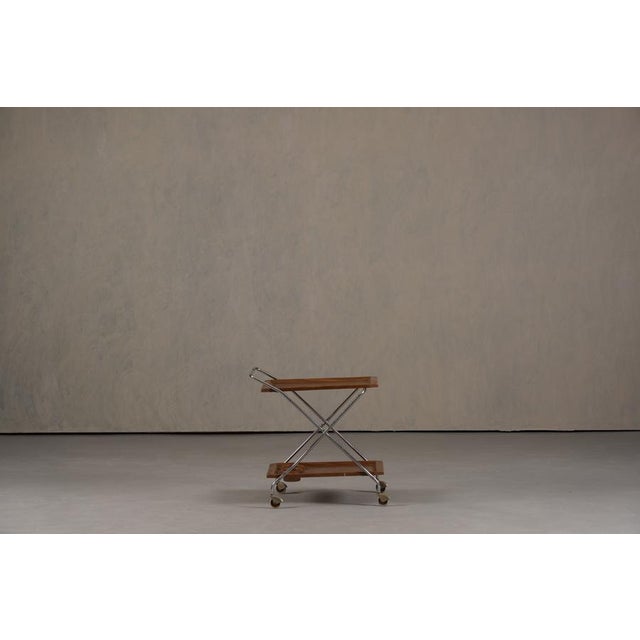 A versatile and stylish 1970s Italian bar cart, crafted from aluminium and plastic, perfect for both dining and living...