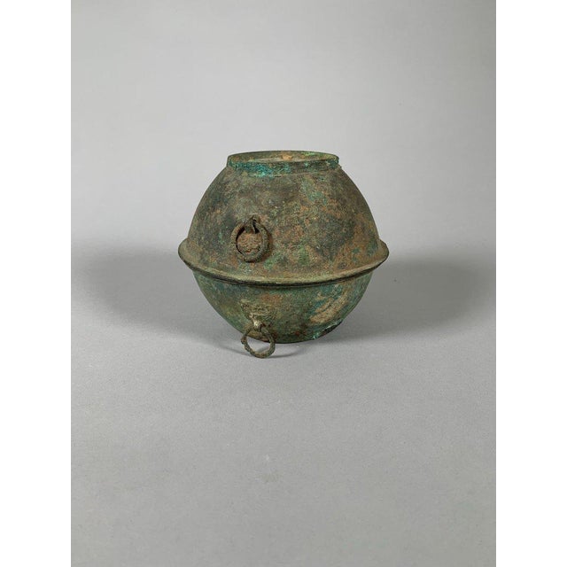Bronze offering steamer, Han Dynasty, 206 BC-220 AD. The steamer is composed of three parts: a bowl, a semi-covered cup,...