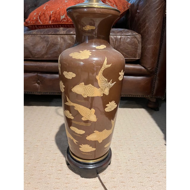 Has expected wear from age and use. Stunning pair of lamps with golden koi Dimensions 8.0" W x 36.5" H x 8.0" D