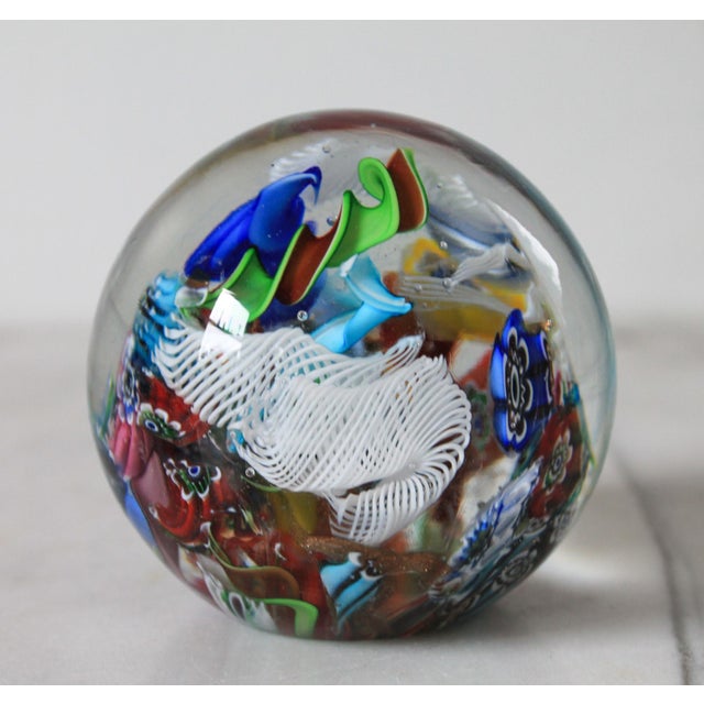Vintage Murano glass paperweight. Made in Italy. Makers mark on bottom. One small chip. Pictured.