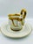 A beautifully preserved collection of Sadek Gilded Swan cups and saucers! The pattern features swan feathers enveloping...