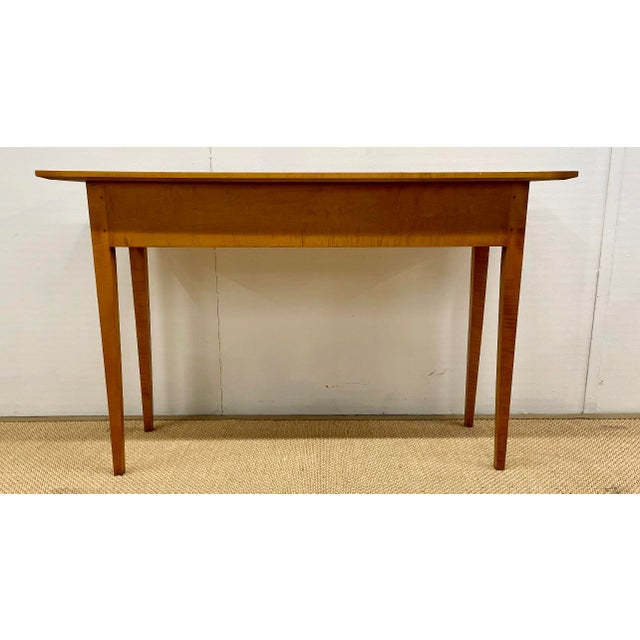 Attractive tiger maple wood console table with two drawers by Eldred Wheeler. Eldred Wheeler was a furniture company known...