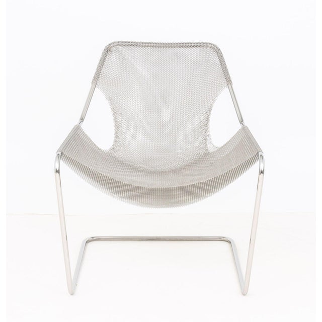 Objekto Paulistano Mesh Stainless Steel Arm Chair, originally designed by Paulo Mendes da Rocha in 1957, label to back...