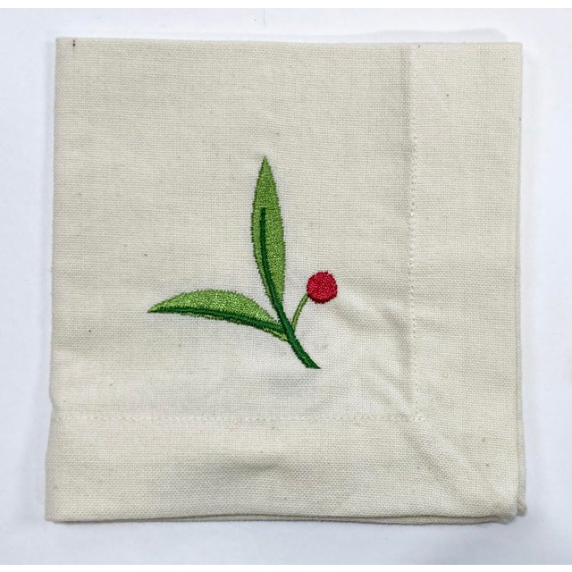 Vintage set of four linen cocktail napkins. Each is embroidered with bright red berries and green leaves. A wonderful...