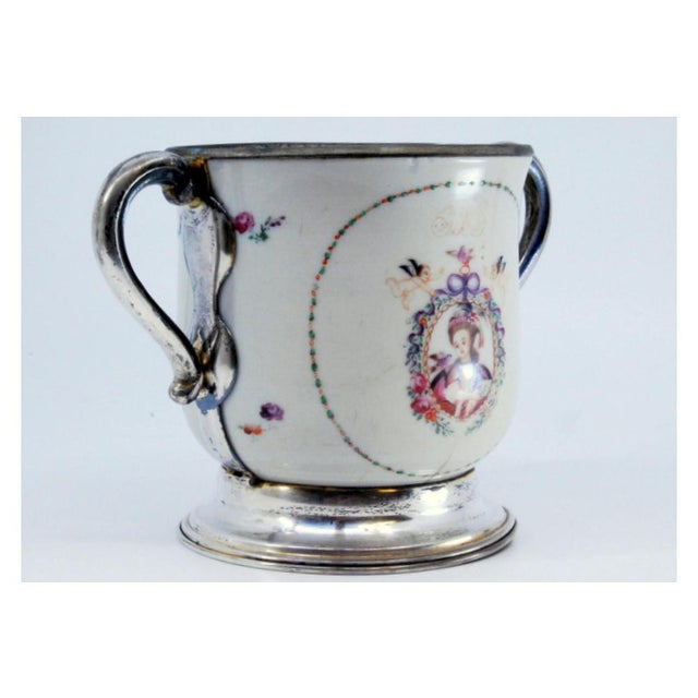 Porcelain Mug with Japanese Motifs, Silver Base, Handles and Rim, in Very Good conditions. Designed from 2000 This piece...