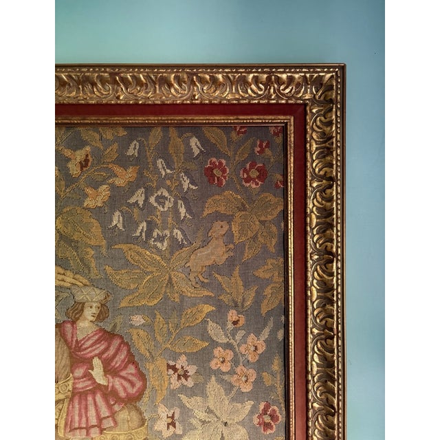 A beautifully detailed vintage woven tapestry featuring a romantic medieval-style scene with elegantly dressed figures on...