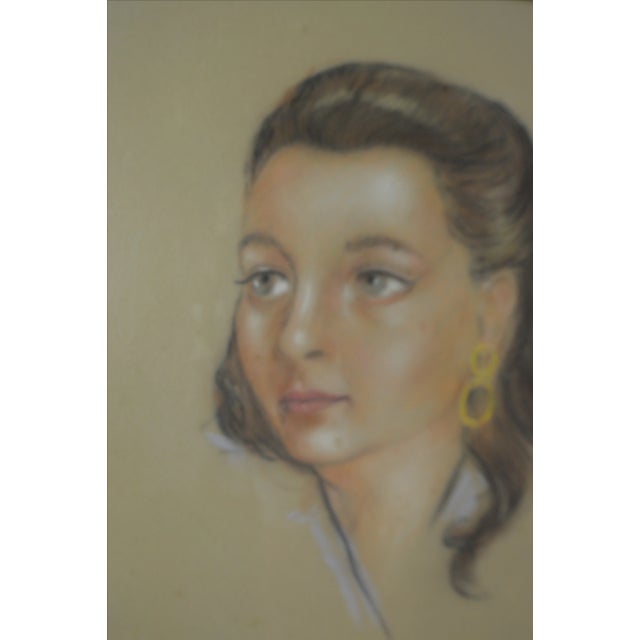 Vintage framed pastel sketch of a French woman. Signed J. Sanglaz. Dated 1953. In its original frame.