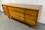 Bring timeless mid-century style and exceptional craftsmanship into your home with this vintage nine-drawer dresser by...