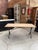 This vintage bistro table has been completely restored. It features a beautiful raw oak tabletop and a cast-iron base,...