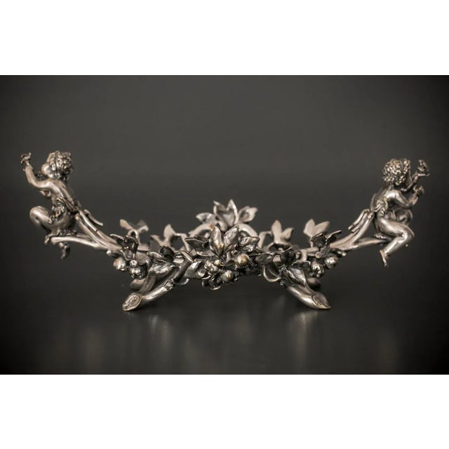 Antique silver plated fruit bowl. The basket is in the form of massive branches with fully plastic leaves and fruits....