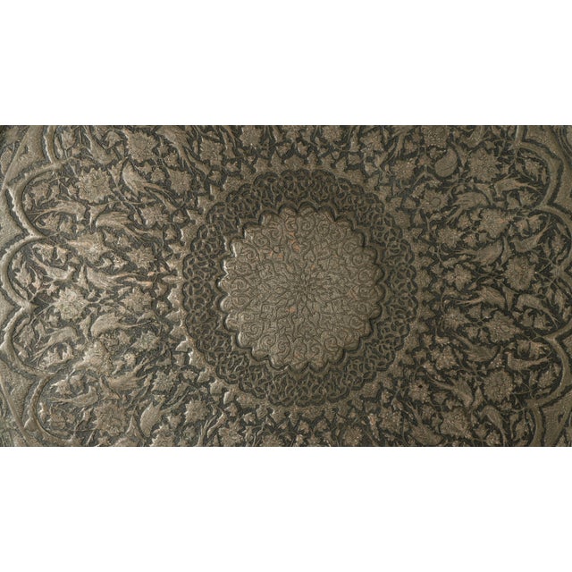 This striking 1960s African table showcases exceptional craftsmanship through its sculptural, hand-carved wooden base...