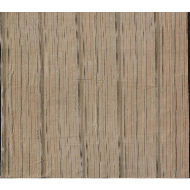 Measures: 7'6 x 12'8 Turkish Vintage Kilim Rug with in Tan, Taupe, Brown, Blue, and Earth Tones. Keivan Woven Arts / rug...