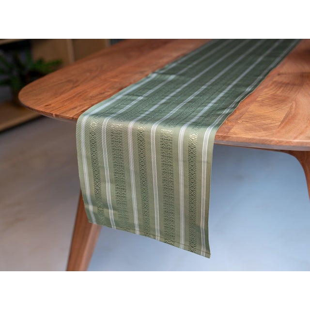 Midori. The green that grows. Described in Japanese colour nomenclature as the green of new foliage and moss — woven here...