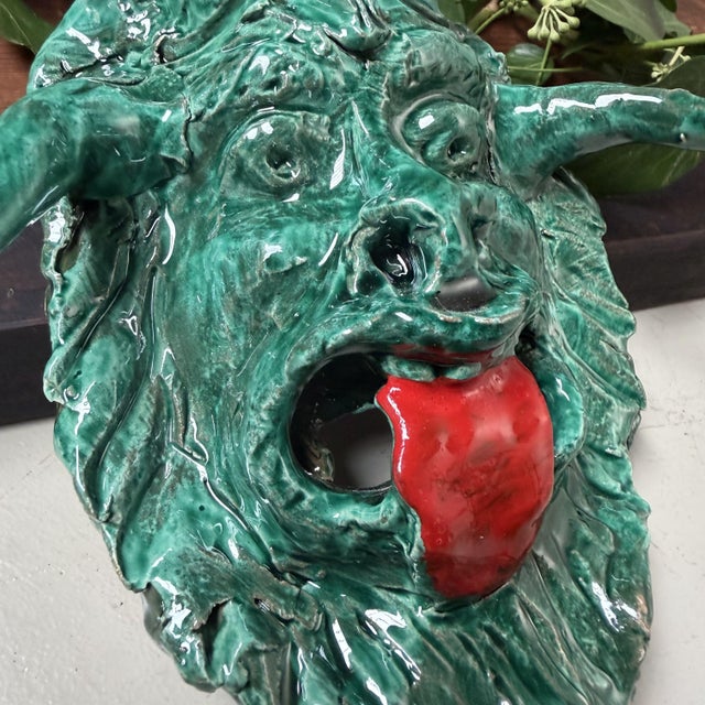 An expressive ceramic wall mask from Seminara, the renowned pottery village in Calabria, made by Gennaro Condurso, a...