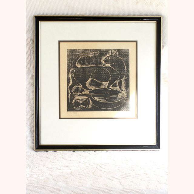 A signed print by E. Romano or Emanuel Romano signed and titled "Cat and Lute." 2nd State Artist's Proof. 100% rag...