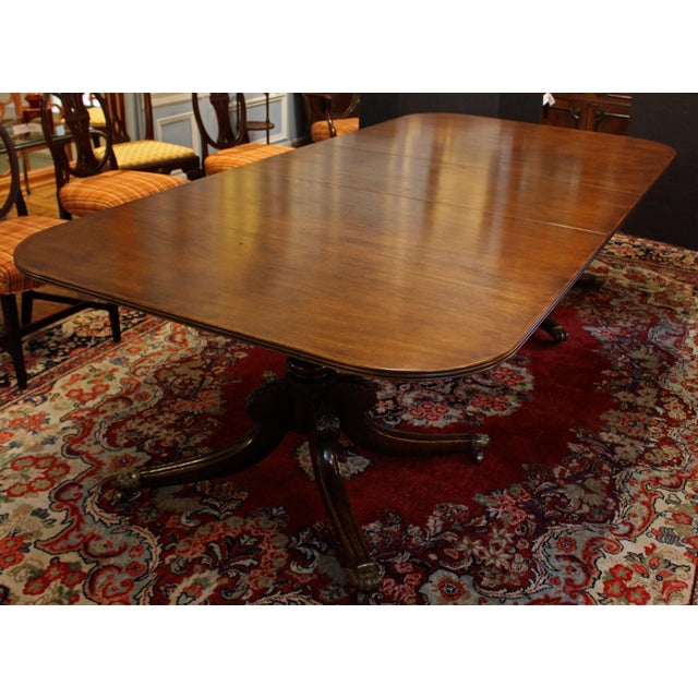 Circa 1830 Regency-William IV double pedestal banquet table with two leaves, English. Finest timbers throughout. Note the...