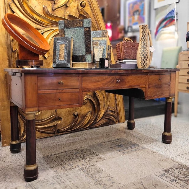 Spectacular French work table, First Empire France, circa 1810. In mahogany palm and leather embossed in gold on the...