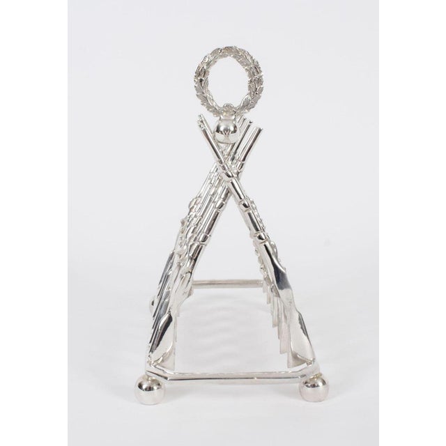 This is a delightful vintage silver plated crossed rifle toast rack dating from the second half of the 20th Century. Seven...
