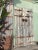 Old Mongolian wood door or gate. Original iron ring handles and iron strap details. Beautiful aged pine wood with signs of...