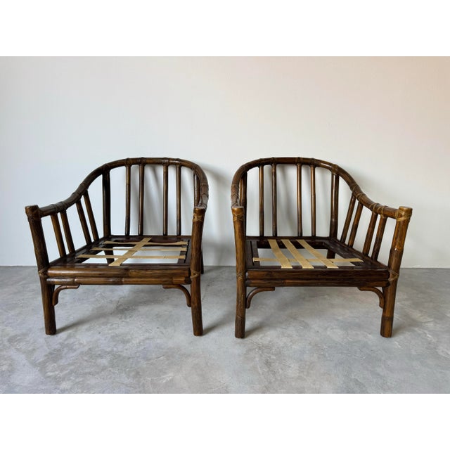 Beautifully crafted pair of vintage lounge chairs designed by Elinor McGuire for McGuire of San Francisco, known for her...