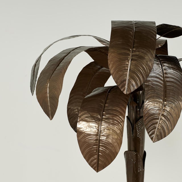 Chic mid century Italian banana tree sculpture crafted in brass in a bold stylized form with removable palms set in a...