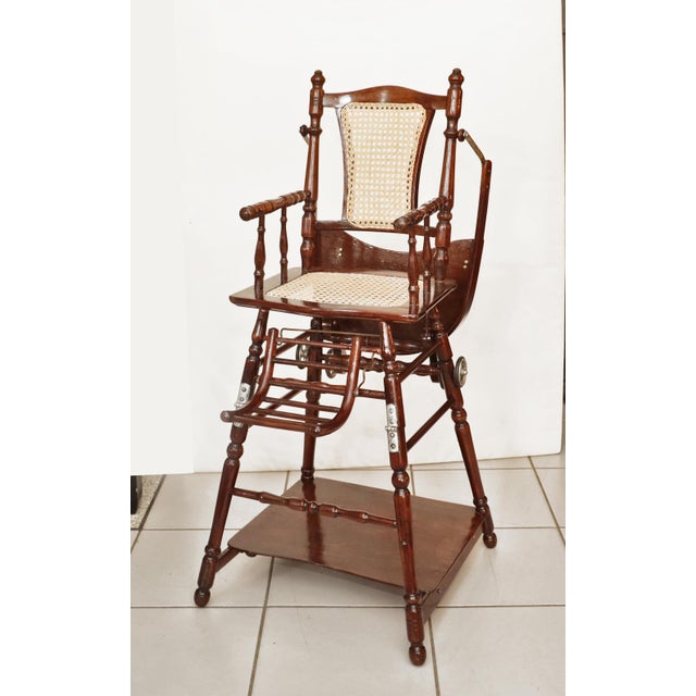 Antique children's chair Children's rolling chair made in 1880/1900. Turned beechwood, restored, re-woven. Children's...