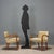 A pair of vintage armchairs with exposed beech wood armrests, sprung padding, and period ochre vinyl upholstery. This...