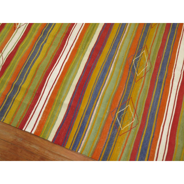 20th century Turkish Kilim with a striped design in jolly rancher tones.