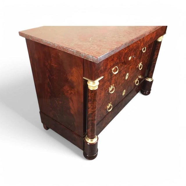 French Empire Chest of Drawers, France, 1810 – A Timeless Antique Masterpiece This exquisite French Empire chest of...