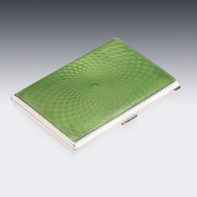20th Century silver and guilloche enamel cigarette case, of a rectangular form with rounded sides. The one side of the...