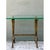 An early 20th century Art Deco side table with a clear rectangular glass top and a sculptural bronze base. The frame has...