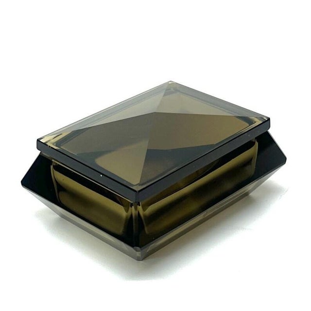This is a gorgeous mid-century modern faceted smoked glass trinket box with a removable lid. This jewelry box features a...