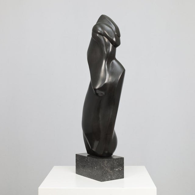 A refined bronze sculpture depicting a stylized female figure, created by francine govers in the netherlands during the...