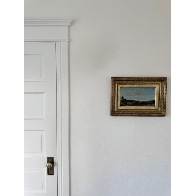 Lovely petite 19th c landscape, oil on canvas in a period correct gilt wood frame. Frame appears to be original, as paper...