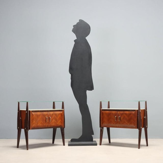 Pair of vintage 1960s nightstands, featuring a sleek design that combines functionality and aesthetics. Made of stained...