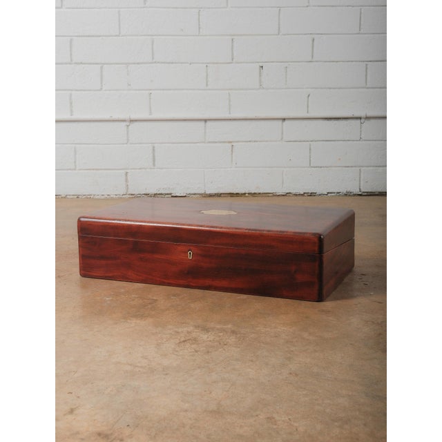 This vintage mahogany document box features beautifully figured wood grain and a classic rectangular form with rounded...