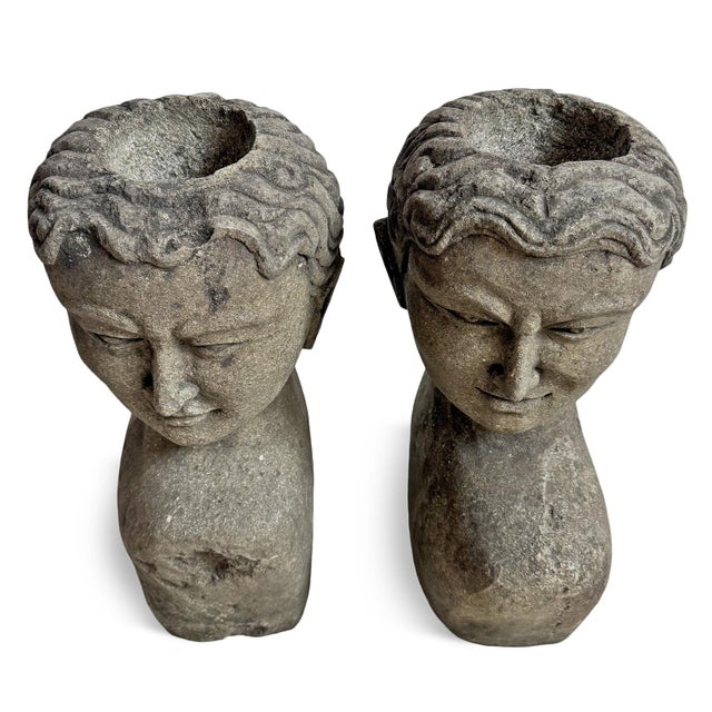 Striking pair of vintage Indonesian stone goddess busts. Hand-carved from solid stone, each sculpture features serene...