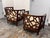 Design Plus Gallery presents a Pair of Ankara Lounge Chairs by Crate & Barrel. Each chair has a curved tub-style wood...
