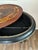 Elegant oval jardinière stand with beautifully inlaid decoration, ebonized legs, gilt metal mounts, and castors. The piece...