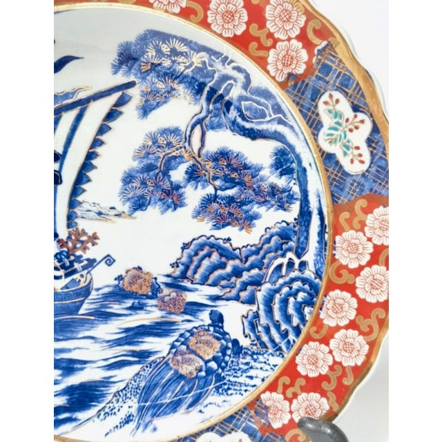 A magnificent and substantial 14-inch Japanese Imari porcelain charger featuring classic auspicious motifs in rich...