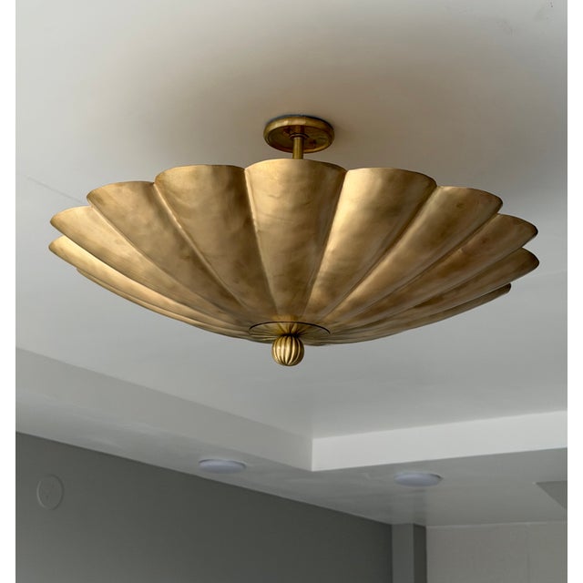Transform your space with this stunning flower-inspired flush mount ceiling light, featuring gracefully sculpted scalloped...