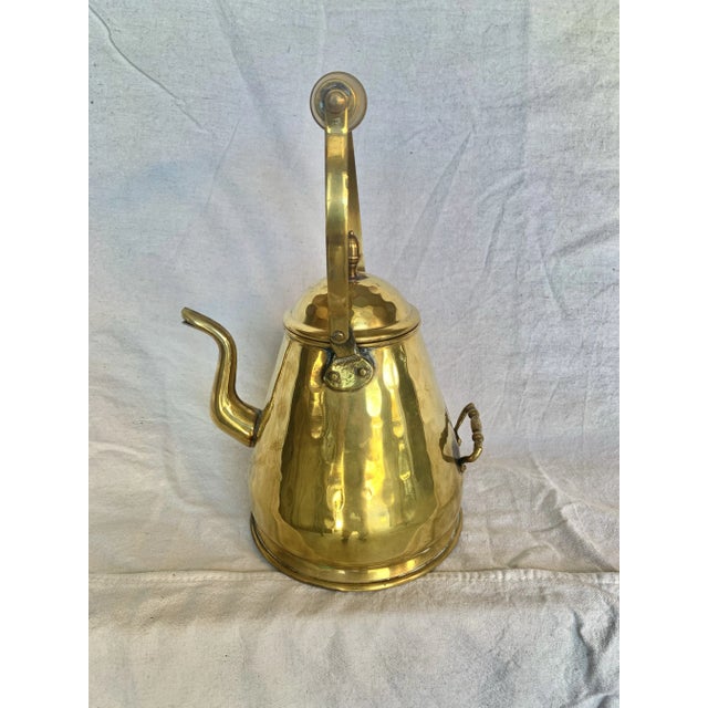 This 19th Century Kettle was crafted from brass by artisans in the late 1800's. The piece features two intricately...