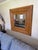 An exceptional vintage split bamboo wall mirror featuring a dramatic wide mitered frame crafted from hundreds of hand-...