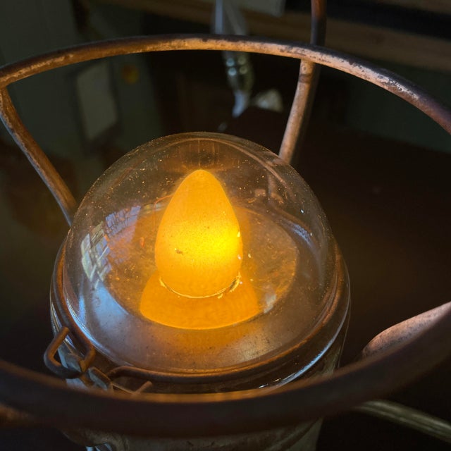 1930s railroad-worker’s lamp converted into an utterly charming little desk lamp. The thick glass dome is still intact!...