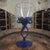 The product is a vintage hand-blown blue stem wine glass attributed to Jozefina Krosno, a contemporary art glass...