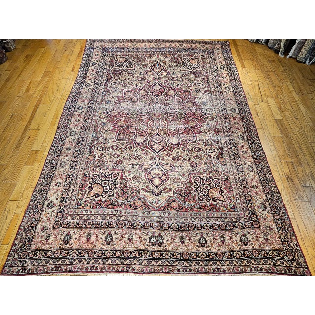 This magnificent late 19th century oversized Persian Kerman Lavar carpet, woven in the fourth quarter of the 1800s. At the...