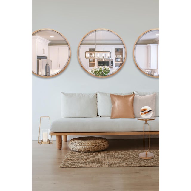 The sleek lines and softly rounded edges give the Johann round beveled mirror a sophisticated European styling. The light...
