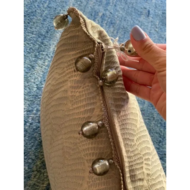 This is a sea foam green decorative pillow that brings culture to your living space! It is covered in silk material with...