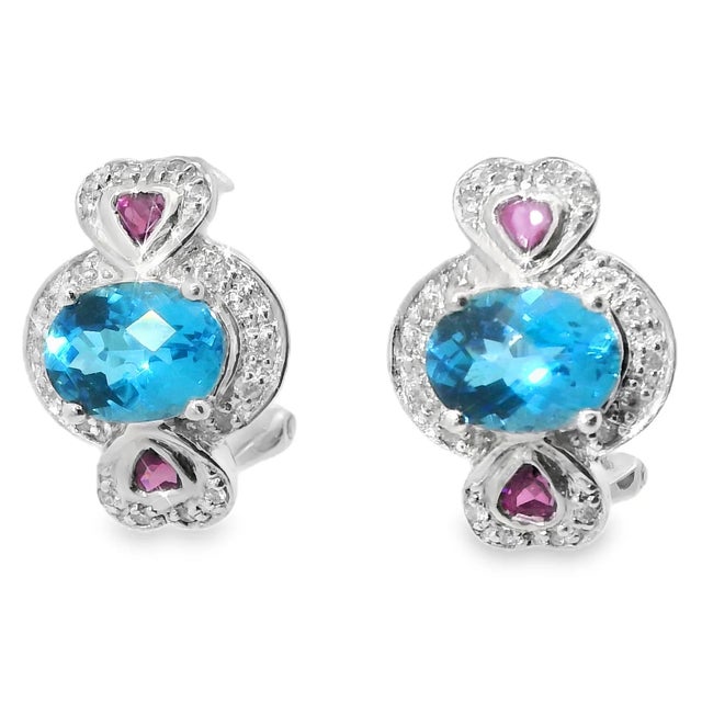 These elegant estate earrings feature a romantic heart-inspired design crafted in 14K white gold . Each earring showcases:...