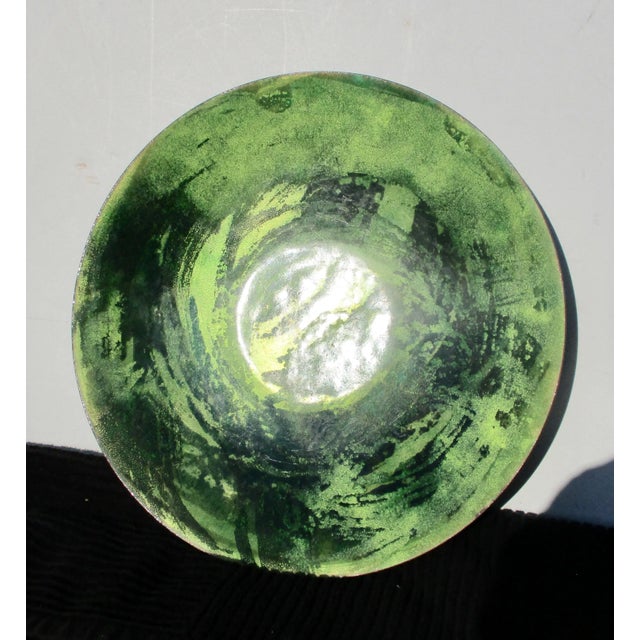 Bright enamel tray with abstracted green enamel center. Transparent green enamels on a coppery body. Heavy body with...